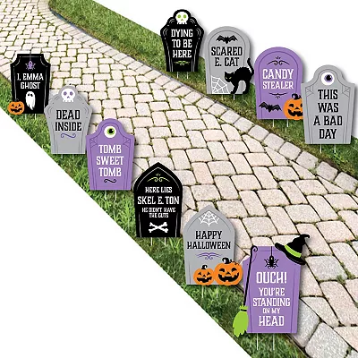 Halloween tombstone decorations with cheesy phrases on each.